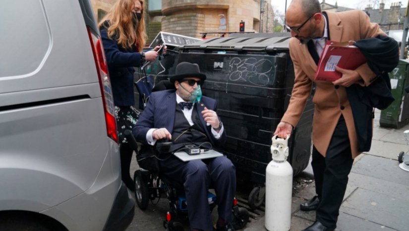 nicholas rossi in court with wheelchair and oxygen bottle