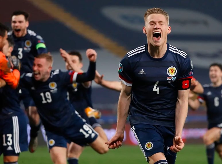 scotland players celebrating euro qualification