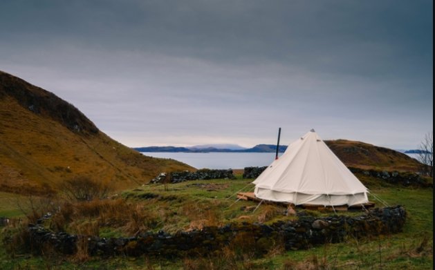 White glamping tents with views of the sea in Scotland, Isle of Jura