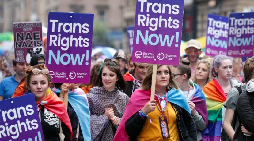 Police Scotland badge and transgender rights protest