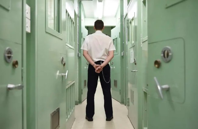 Scottish prison cell, prison door guard, early release Scottish inmates,