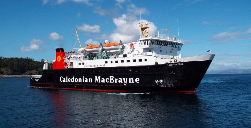 A stranded ferry at Lochboisdale pier with waiting passengers.