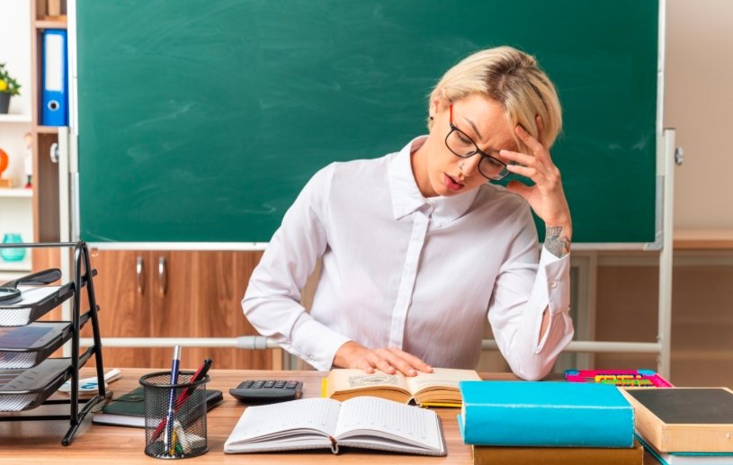 stressed teacher at desk