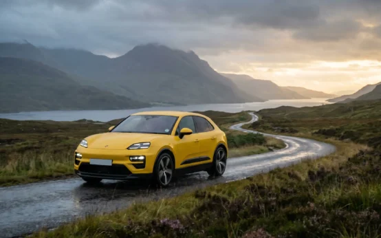 Electric Porsche Macan Turbo on Scotland's North Coast 500 Highland coastal route.