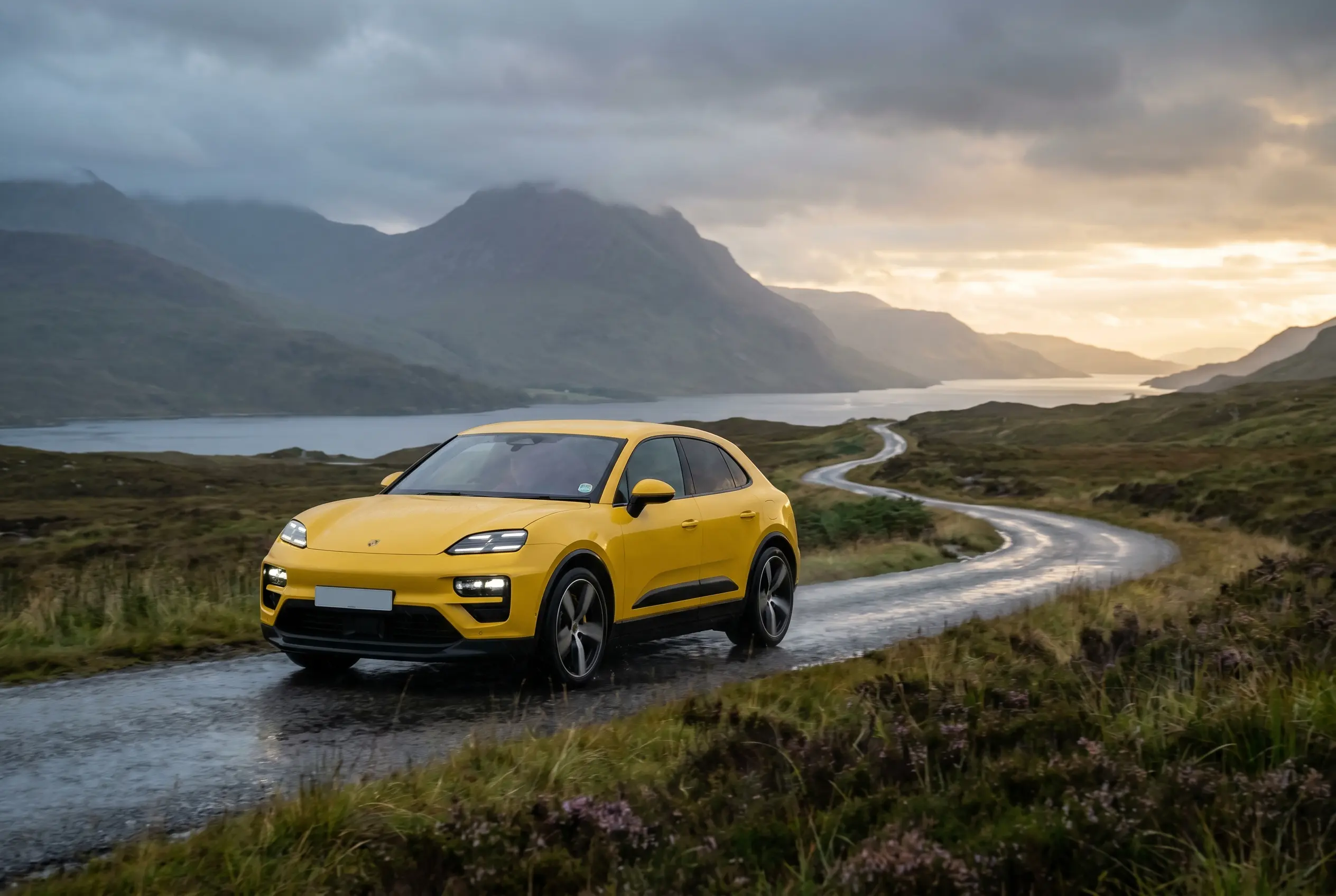 Electric Porsche Macan Turbo on Scotland's North Coast 500 Highland coastal route.