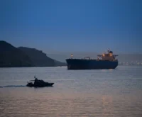 Oil tanker crosses Strait of Hormuz as US Iran ceasefire holds tenuously.