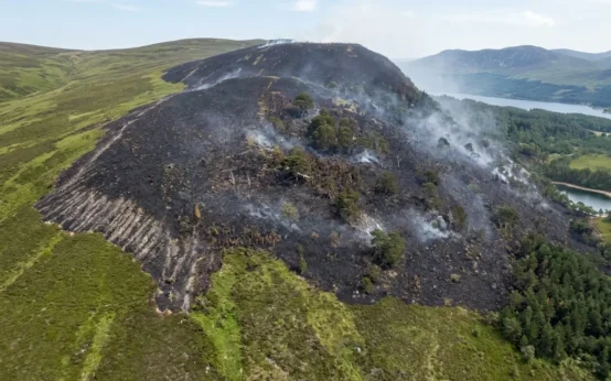 Cairngorms wildfire smoke rising scorched peatland Highlands Scotland
