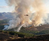 helicopter waterbombing Cairngorms wildfire Glenmore Forest Scotland