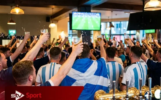 Scotland fans Glasgow pub celebrate Argentina beating England World Cup